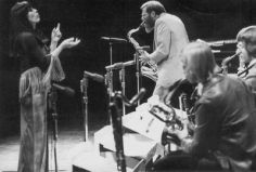 Toshiko Akiyoshi conducts her big band; Lew Tabackin solos on saxophone